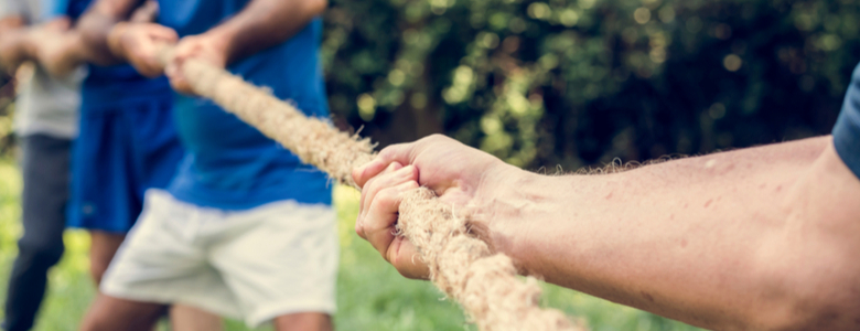 Men involved in a tug of war