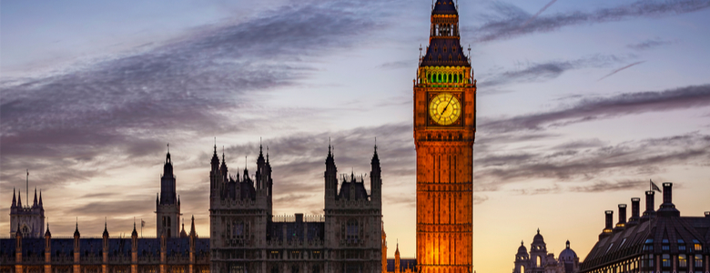 An external image of the Palace of Westminster in the evening