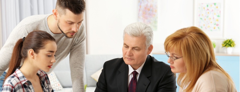 A family working with a financial planner.