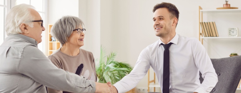 A couple speaking to a financial planner.