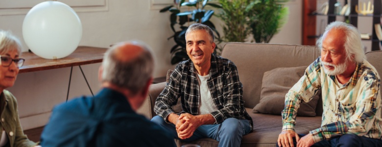An older group of friends having a conversation.