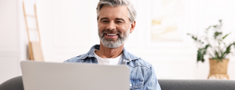 A man using his laptop.
